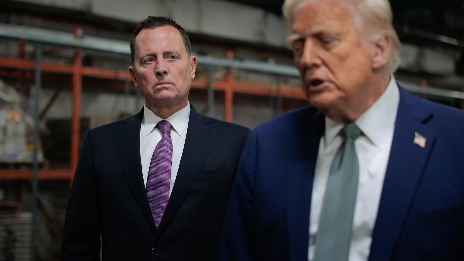 U.S. President Donald Trump speaks to the media alongside Richard Grenell.