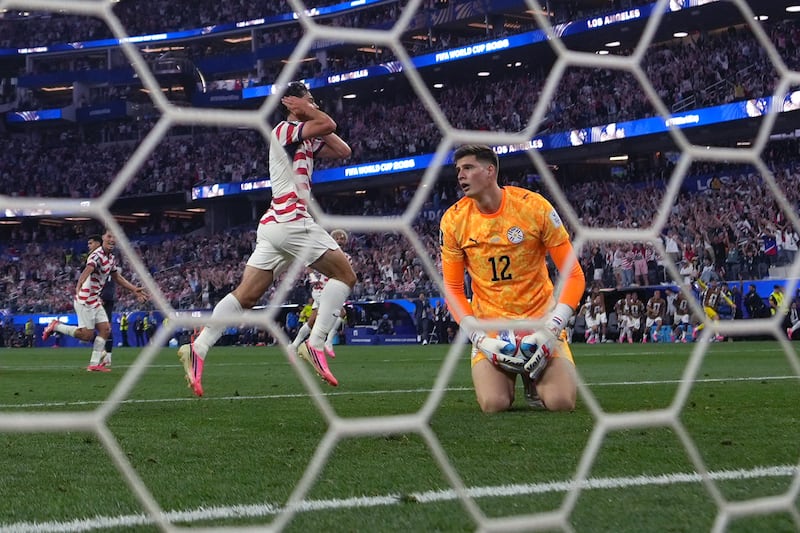 Jun 12, 2026; Inglewood, California, USA; USMNT midfielder Giovanni Reyna (7) celebrates after a goal in stoppage time against Paraguay goalkeeper Orlando Gill (12) during a Group D match in the 2026 FIFA World Cup at Los Angeles Stadium. Mandatory Credit: Kirby Lee-Imagn Images