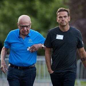Rupert Murdoch walks alongside his son, Lachlan Murdoch, the co-chairman of 21st Century Fox.