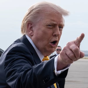 President Donald Trump speaks to journalists before boarding Air Force One at Palm Beach International Airport on May 2, 2026 in Palm Beach, Florida.