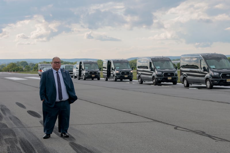 White House Communications Director Steven Cheung looks on as U.S. President Donald Trump walks off Air Force One at the Lehigh Valley International Airport on August 01, 2025 in Allentown, Pennsylvania.