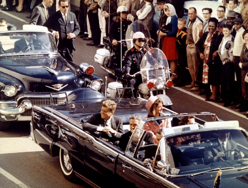 President and Mrs. John F. Kennedy and Texas Governor John Connally ride through Dallas moments before Kennedy was assassinated, November 22, 1963.