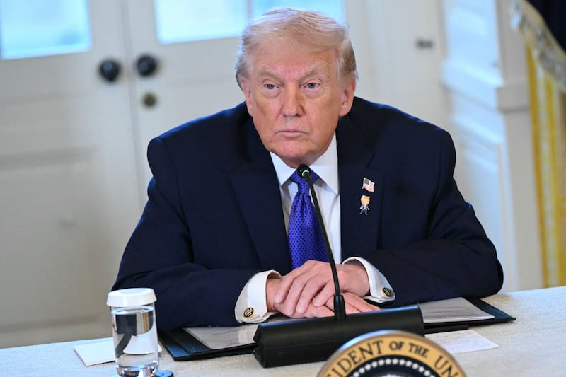 President Donald Trump looks on during a meeting with US oil companies executives in the East Room of the White House in Washington, DC on January 9, 2026.