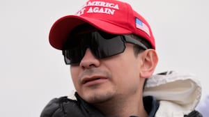 Bryan Betancur holds a Certificate of Pardon from President Donald Trump during a January 6th memorial march marking five years since the attack on January 06, 2026, in Washington, DC.