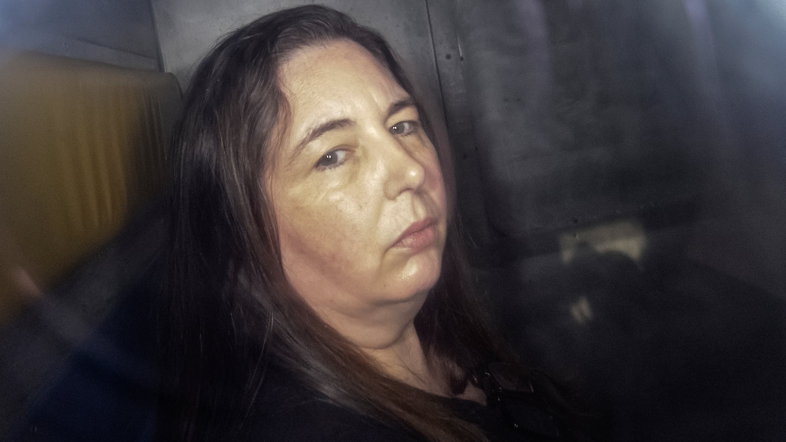 TOPSHOT - This picture taken on May 12, 2025 shows Erin Patterson arriving in the back of a prison transport vehicle at Latrobe Valley Magistrate's Court in Morwell, Australia. An Australian woman murdered her husband's parents and aunt by lacing their beef Wellington lunch with toxic mushrooms, a jury found on July 7 at the climax of a trial watched around the world. Keen home cook Erin Patterson hosted an intimate meal in July 2023 that started with good-natured banter and earnest prayer -- but ended with three guests dead. (Photo by Martin KEEP / AFP) / For any use in Australia and New Zealand, please contact the AFP sales department at sydsales@afp.com or +61 405 149 534. (Photo by MARTIN KEEP/AFP via Getty Images)