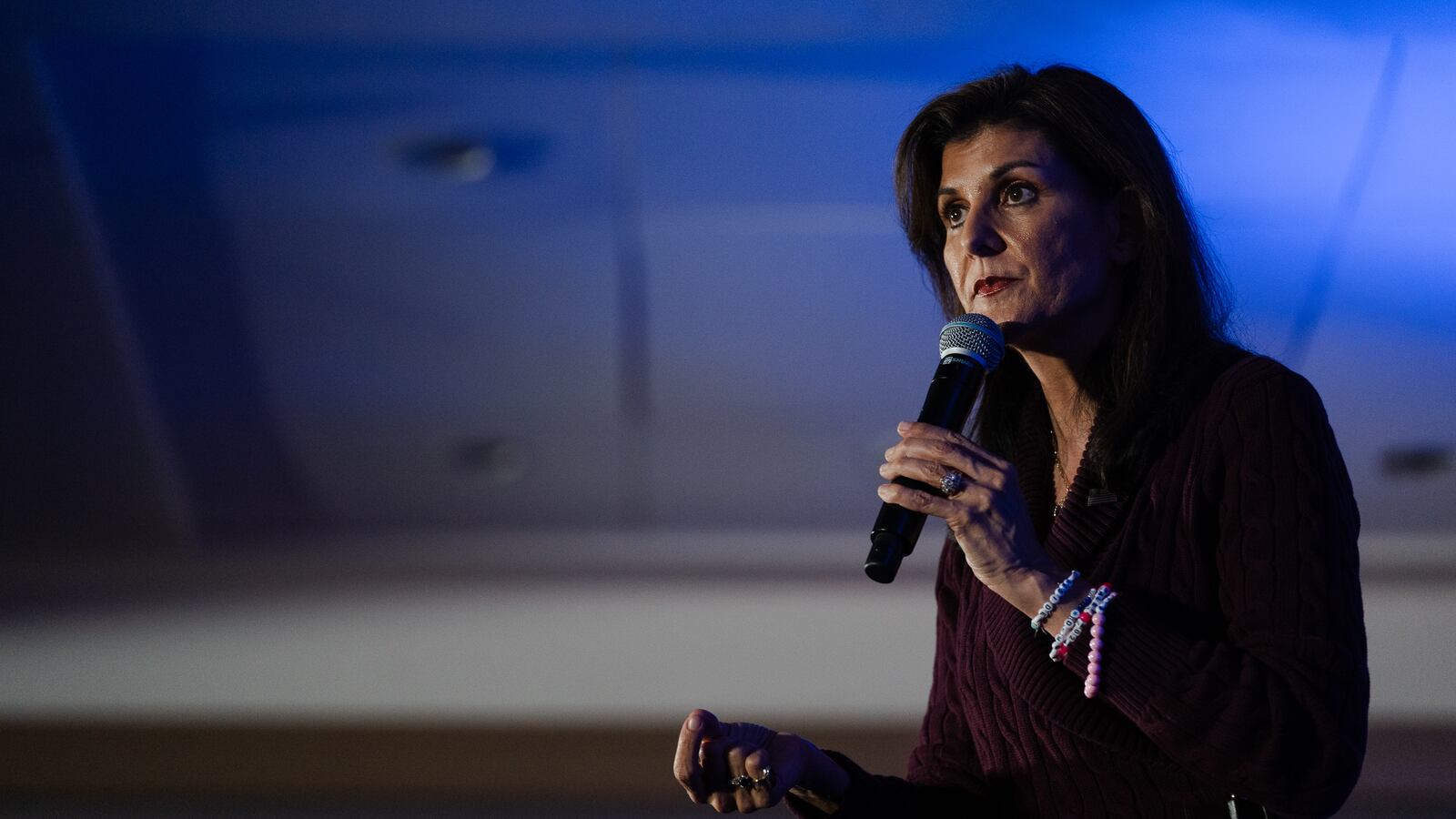 Nikki Haley holding a microphone
