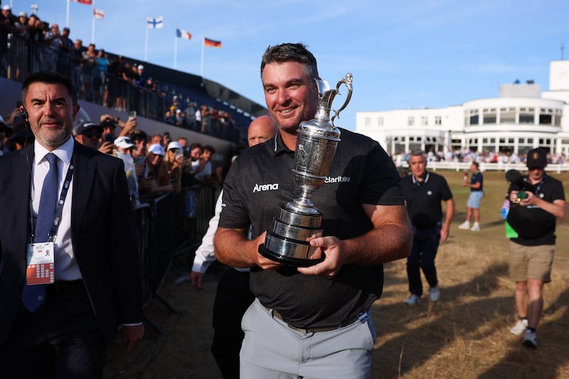 Jul 19, 2026; Southport, ENG; Ryan Fox takes a victory lap with the Claret Jug after winning the The Open Championship golf tournament at Royal Birkdale. Mandatory Credit: Bill Streicher-Imagn Images