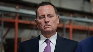 U.S. President Donald Trump speaks to the media alongside Richard Grenell.