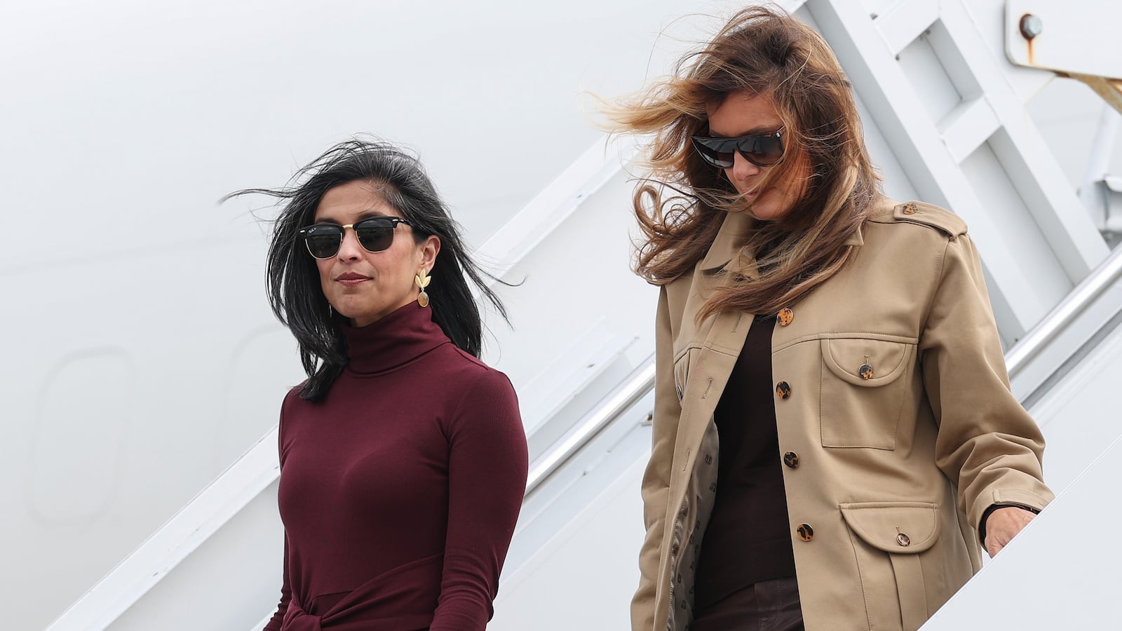 RICHLANDS, NORTH CAROLINA - NOVEMBER 19: Second lady Usha Vance (L) and first lady Melania Trump depart a plane as they arrive at Albert J. Ellis Airport en route to Camp Lejeune on November 19, 2025 in Richlands, North Carolina. Trump and Vance are traveling together for the day to visit military families and schools at Marine Corps Base Camp Lejeune. (Photo by Anna Moneymaker/Getty Images)