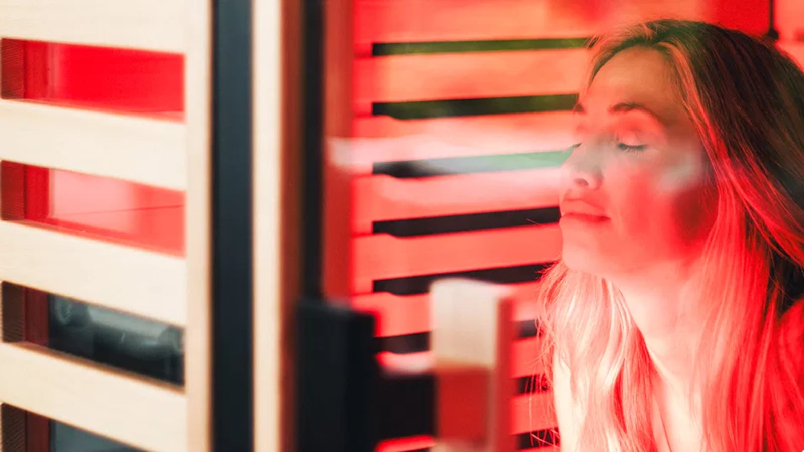 Woman using a Full Spectrum Infrared Sauna by Peak Saunas