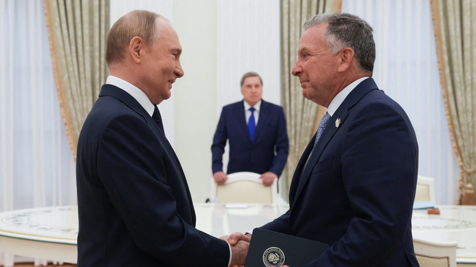 In this pool photograph distributed by the Russian state agency Sputnik, Russia's President Vladimir Putin greets US Special Envoy Steve Witkoff prior to their talks in Moscow on August 6, 2025.