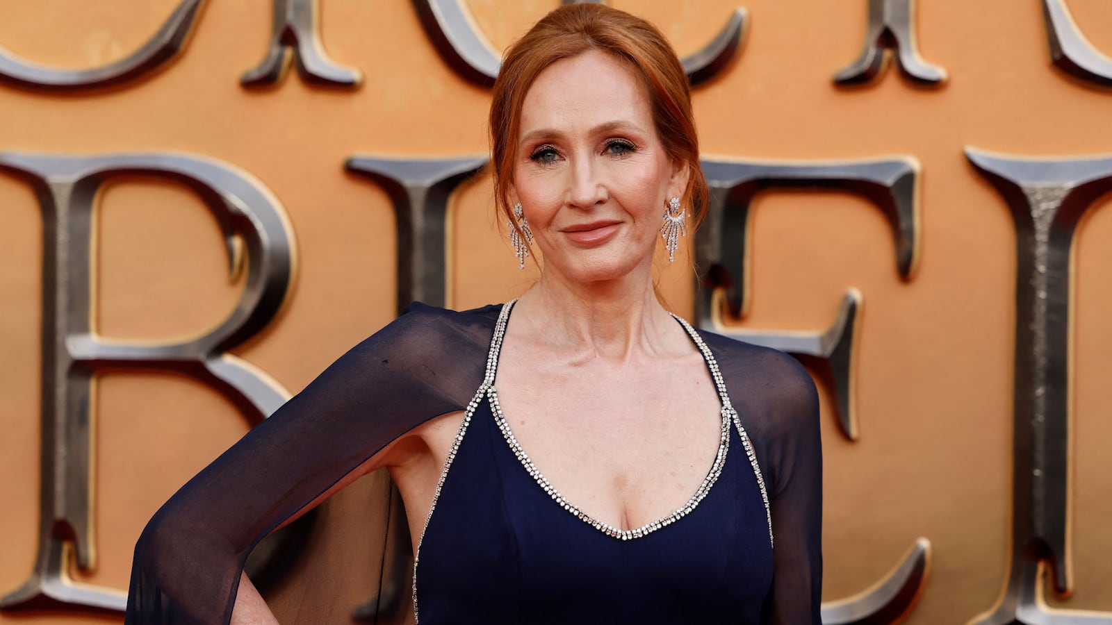 British writer J.K Rowling poses on the red carpet after arriving to attend the World Premiere of the film "Fantastic Beasts: The Secrets of Dumbledore" in London on March 29, 2022.