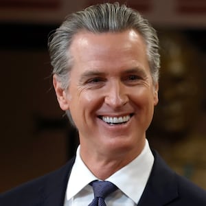 California Gov. Gavin Newsom (L) looks on with San Francisco Mayor Daniel Lurie during a press conference at Friendship House Association of American Indians on January 16, 2026 in San Francisco, California.