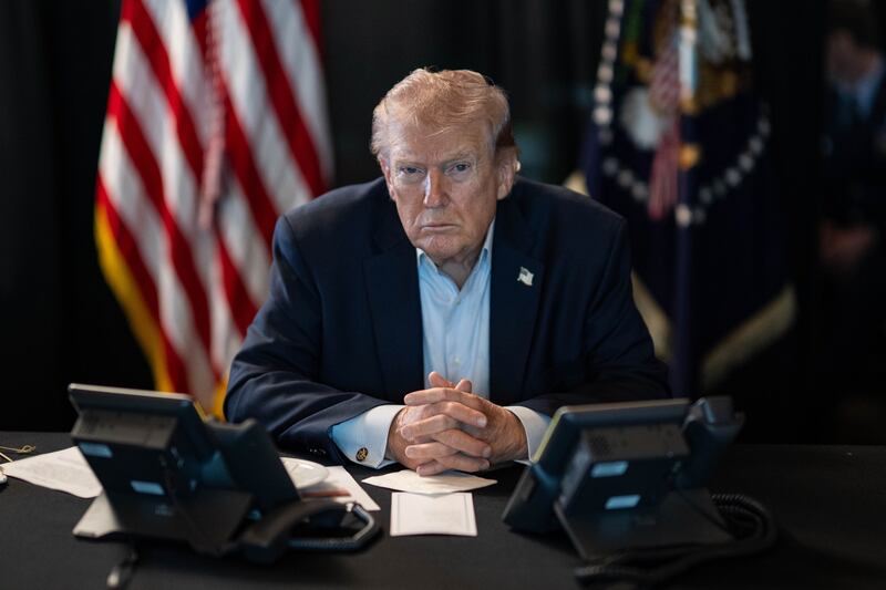 WASHINGTON DC, USA - MARCH 02: (----EDITORIAL USE ONLY â" MANDATORY CREDIT - 'THE WHITE HOUSE'S X ACCOUNT / HANDOUT' - NO MARKETING NO ADVERTISING CAMPAIGNS - DISTRIBUTED AS A SERVICE TO CLIENTS----) U.S. President Donald J. Trump sits at a table monitoring military operations during Operation Epic Fury against Iran, with U.S. flags visible behind him, in Washington, United States, on March 02, 2026. (Photo by The White House via X Account/Anadolu via Getty Images)