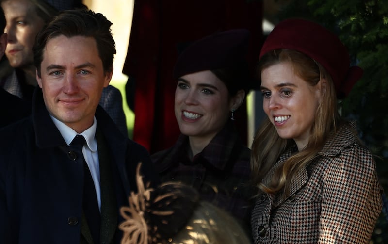 Edoardo Mapelli Mozzi (L), Britain's Princess Eugenie of York (C) and Britain's Princess Beatrice of York leave after attending the Royal Family's traditional Christmas Day service at St Mary Magdalene Church on the Sandringham Estate in eastern England, on December 25, 2025. (Photo by Henry NICHOLLS / AFP via Getty Images)