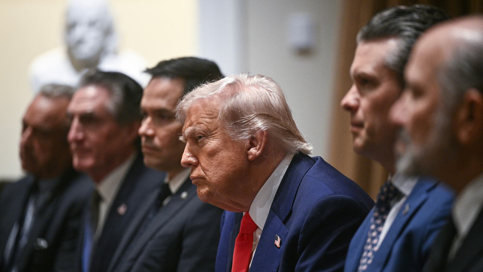 US President Donald Trump (C) looks on during a cabinet meeting in the Cabinet Room of the White House.