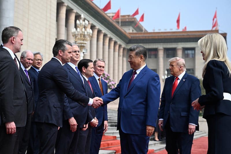 China's President Xi Jinping shaking hands with U.S. Secretary of Defense Pete Hegseth in Beijing, China, in May 2026.