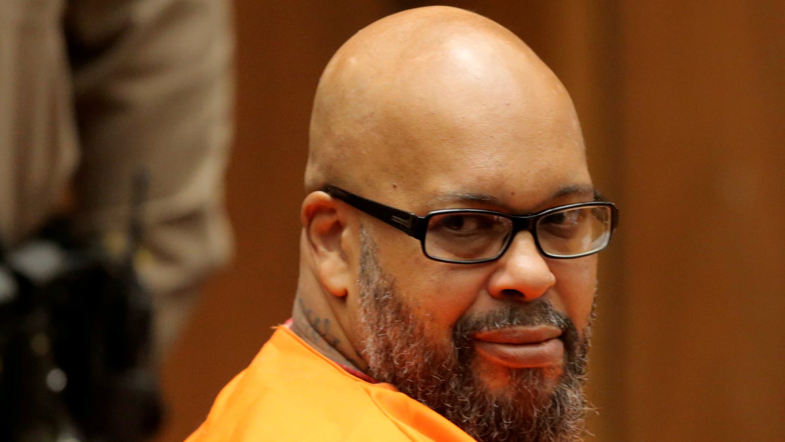 Suge Knight appears in court wearing an orange jumpsuit.