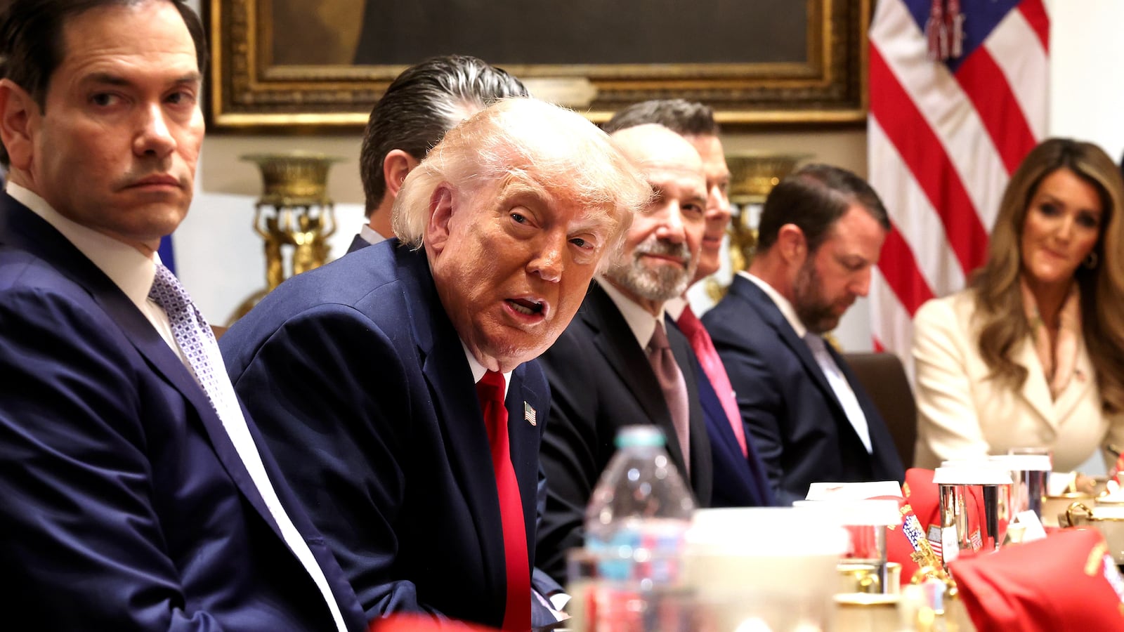 WASHINGTON, DC - MAY 27: U.S. President Donald Trump (C) speaks as (L-R) U.S. Interior Secretary Doug Burgum, U.S. Secretary of State Marco Rubio, U.S. Secretary of War Pete Hegseth, U.S. Commerce Secretary Howard Lutnick, U.S. Transportation Secretary Sean Duffy, U.S. Secretary of Homeland Security Markwayne Mullin and Administrator of the U.S. Small Business Administration Kelly Loeffler listen during a Cabinet meeting in the Cabinet Room of the White House on May 27, 2026 in Washington, DC. Trump meets with his Cabinet days after saying a peace deal with Iran was “largely negotiated” amid expectations around the re-opening the Strait of Hormuz. (Photo by Win McNamee/Getty Images)