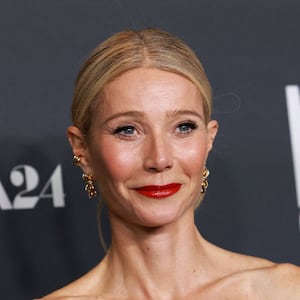 Cast member Gwyneth Paltrow attends a special screening of the film 'Marty Supreme' in 2025 in a black dress, wearing red lipstick.
