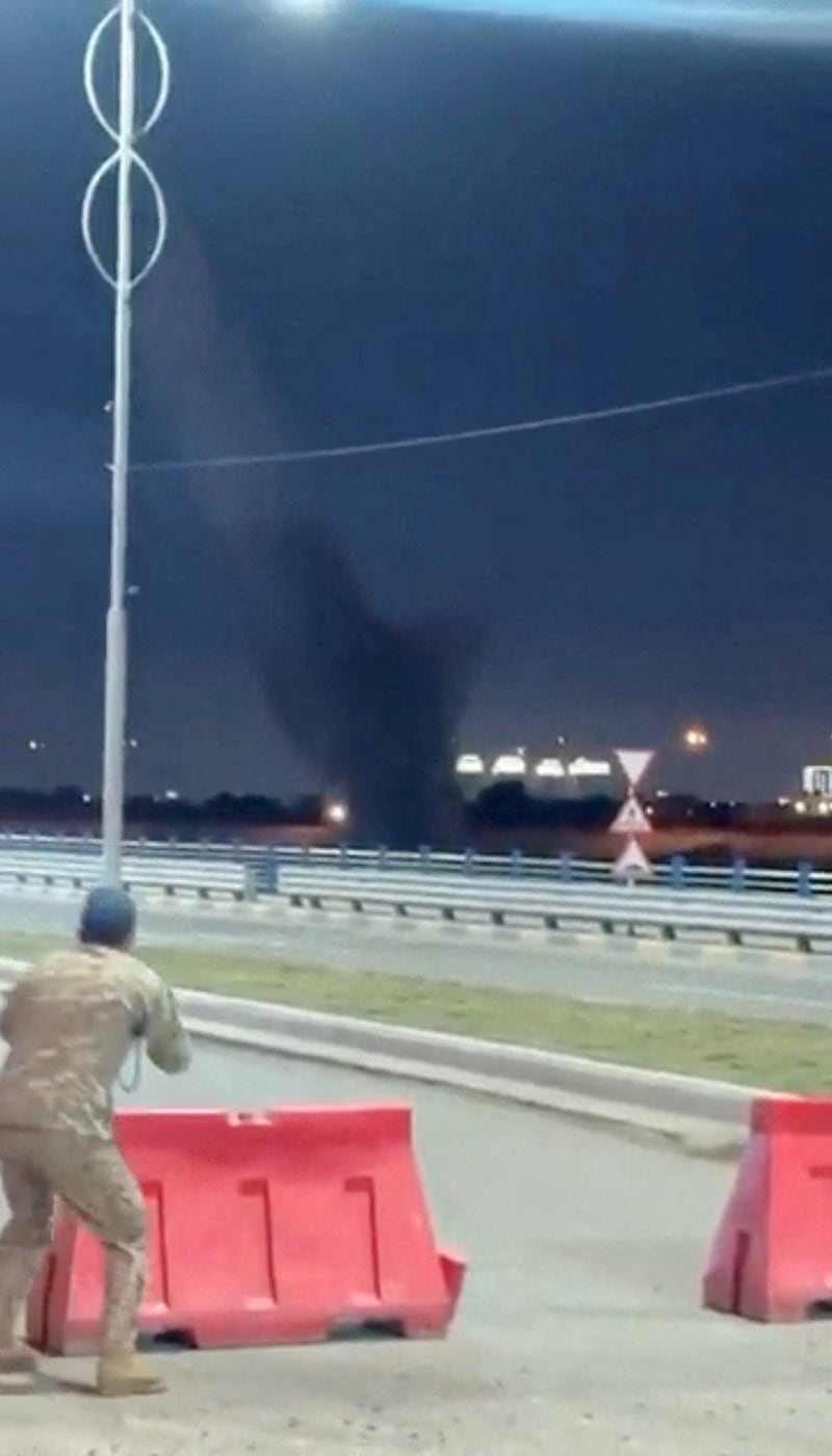 Smoke rises as debris falls to the ground as a C-RAM air defence system intercepts drones during reported drone and rocket attacks on the U.S. embassy, according to Iraqi security sources, in Baghdad, Iraq, in this still image obtained from a social media video released on March 17, 2026. Social Media via REUTERS  THIS IMAGE HAS BEEN SUPPLIED BY A THIRD PARTY. NO RESALES. NO ARCHIVES. NEWS USE ONLY.   VERIFICATION: Reuters was able to confirm the location from the shape of the building, road layout, street lights and vegetation.  Exact time could not be verified but no older version of the video was found posted online before March 17.  Iraqi security sources confirmed that rockets and at least five drones were launched at the U.S. embassy in Baghdad early on Tuesday.  The direction of the C-RAM air defence system was seen moving towards the opposite side of the embassy. Earlier, a Reuters witness confirmed seeing at least three drones heading in the direction of the embassy. Coordinates of the building under attack are 33.29164731525183, 44.390272740582226