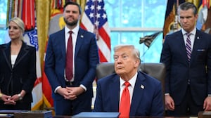 L/R, US Attorney General Pam Bondi, Vice President JD Vance, Defense Secretary Pete Hegseth and Secretary of Homeland Security Kristi Noem look on as US President Donald Trump speaks to the press before signing an executive order that aims to end cashless bail, in the Oval Office of the White House in Washington, DC on August 25, 2025. (Photo by Mandel NGAN / AFP) (Photo by MANDEL NGAN/AFP via Getty Images)