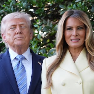 U.S. President Donald Trump and first lady Melania Trump pose for a photo at the White House, April 27, 2026, in Washington.