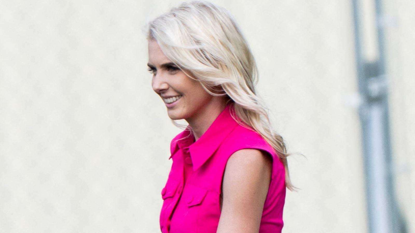 White House aide Natalie Harp walks on the Ellipse near the White House in Washington, DC, August 28, 2026, after arriving on Marine One with the US president.