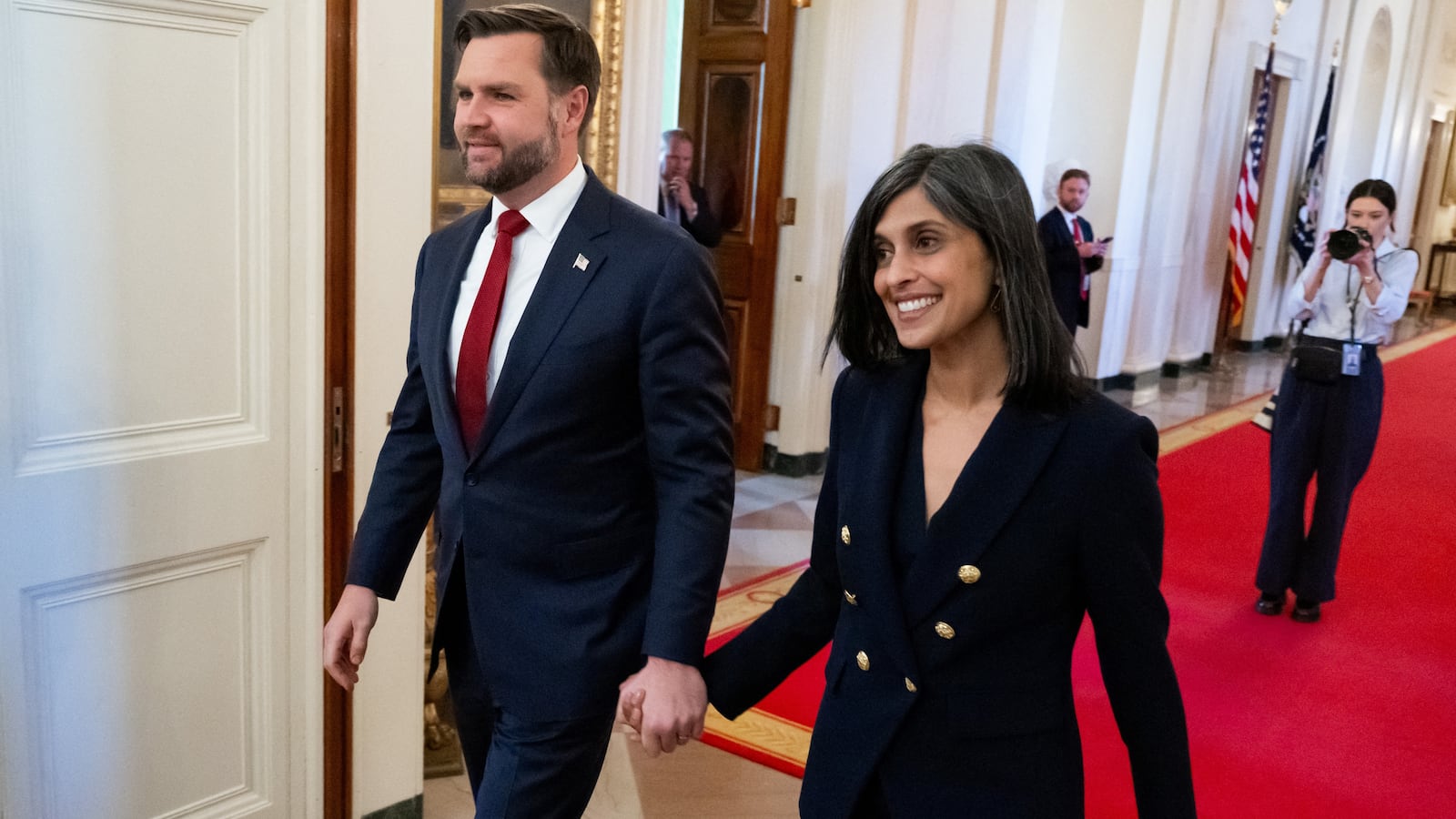 US Vice President JD Vance and Second Lady Usha Vance arrive for President Donald Trump to sign an executive order on foster children and families in the East Room of the White House in Washington, DC, November 13, 2025. The executive order will be focused on supporting foster youth transitioning out of the system to adulthood by expanding and enhancing access to education, workforce and career development, digital resources, and other supports. (Photo by SAUL LOEB / AFP) (Photo by SAUL LOEB/AFP via Getty Images)