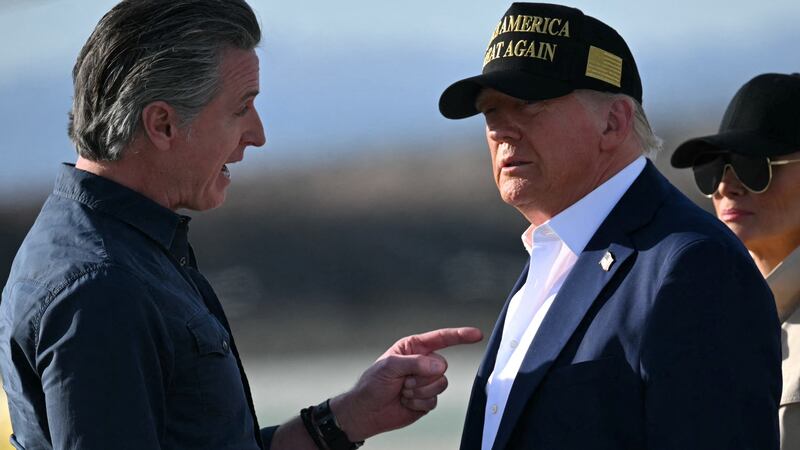 US President Donald Trump and First Lady Melania Trump are greeted by California Governor Gavin Newsom upon arrival at Los Angeles International Airport in Los Angeles, California, on January 24, 2025, to visit the region devastated by the Palisades and Eaton fires. (Photo by Mandel NGAN / AFP) (Photo by MANDEL NGAN/AFP via Getty Images)