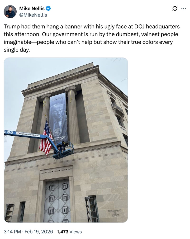 An X post criticizing the banner on the DOJ building.