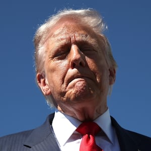 WEST PALM BEACH, FLORIDA - OCTOBER 31: US President Donald Trump speaks to reporters as he arrives at Palm Beach International Airport on October 31, 2025 in West Palm Beach, Florida. Trump is spending the weekend at his Mar-A-Lago estate in Palm Beach, Florida. (Photo by Samuel Corum/Getty Images)