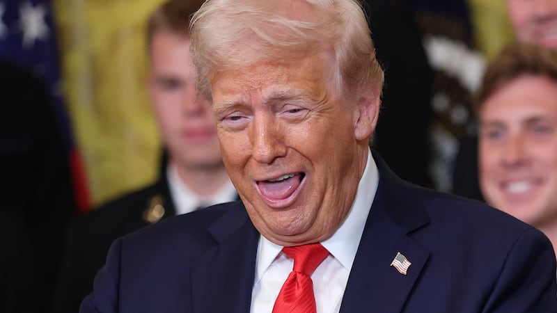 Donald Trump to a large ring during a presentation ceremony for the Commander-in-Chief Trophy.