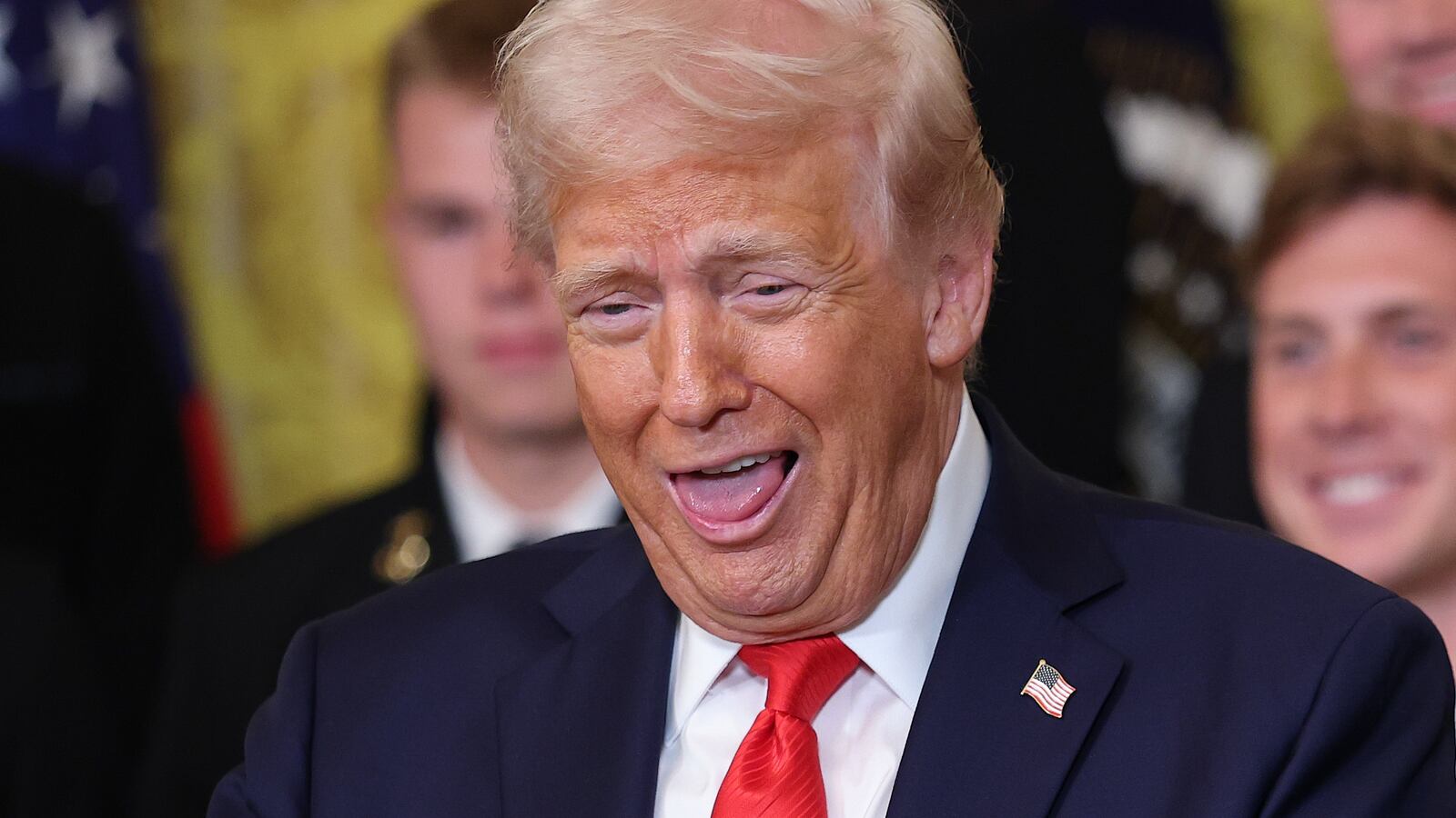 Donald Trump to a large ring during a presentation ceremony for the Commander-in-Chief Trophy.
