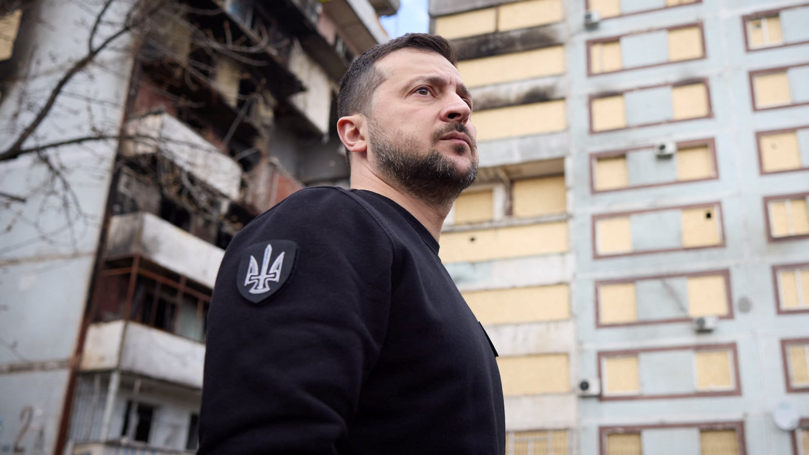 Volodymyr Zelenskiy visits a site of residential buildings recently damaged by a Russian missile strike, amid Russia’s attack on Ukraine, in Zaporizhzhia, Ukraine, March 27, 2023.