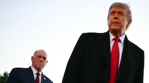 US President Donald Trump, flanked by White House 'border czar' Tom Homan (L) and US Secretary of Homeland Security Markwayne Mullin (R), speaks with workers who have been painting the Lincoln Memorial Reflecting Pool in Washington, DC, on May 7, 2026. Workers have been resurfacing the bottom of Washington's famous Lincoln Memorial Reflecting Pool with "American flag blue"-colored material used in swimming pools, following an order by US President Donald Trump. (Photo by Kent NISHIMURA / AFP via Getty Images)