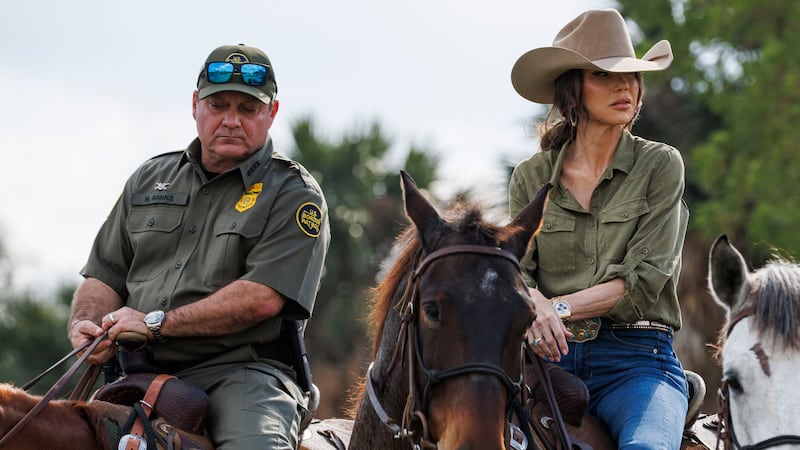 U.S. Secretary of Homeland Security Kristi Noem tours the bank of the Rio Grande river on horseback alongside U.S. Border Patrol Chief Mike Banks