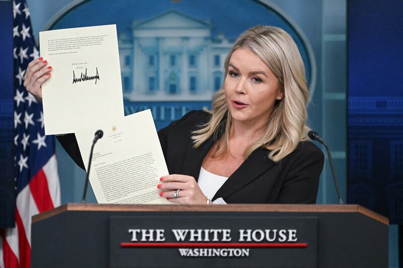 White House Press Secretary Karoline Leavitt holds a letter from President Donald Trump addressed to South Korean President Lee Jae-myung as she speaks during the daily briefing in the Brady Briefing Room of the White House in Washington, DC, on July 7, 2025.