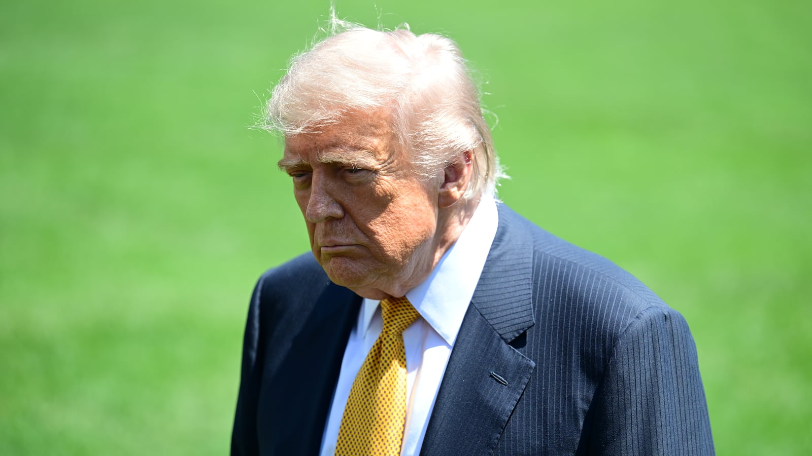 WASHINGTON, UNITED STATES - MAY 12: U.S. President Donald Trump speaks to members of the press before boarding Marine One on the South Lawn of the White House in Washington, United States, on May 12, 2026. (Photo by Kyle Mazza/Anadolu via Getty Images)