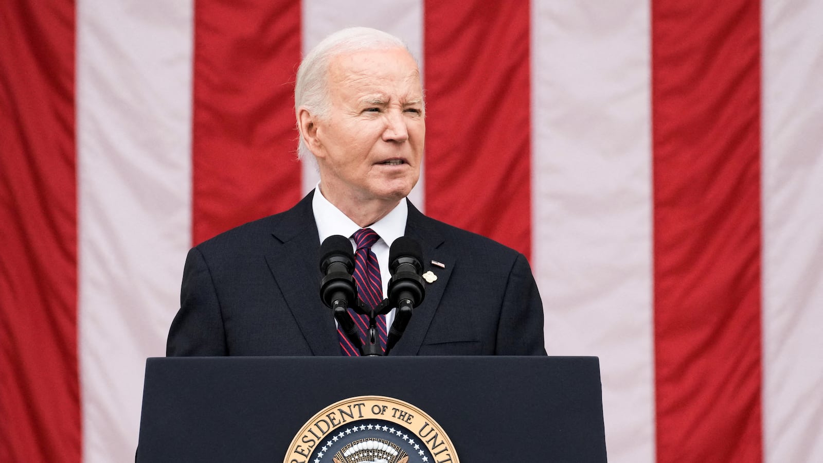 President Joe Biden speaks during the National Memorial Day Wreath-Laying and Observance Ceremony at Arlington National Cemetery, in Arlington, Virginia on May 27, 2024.