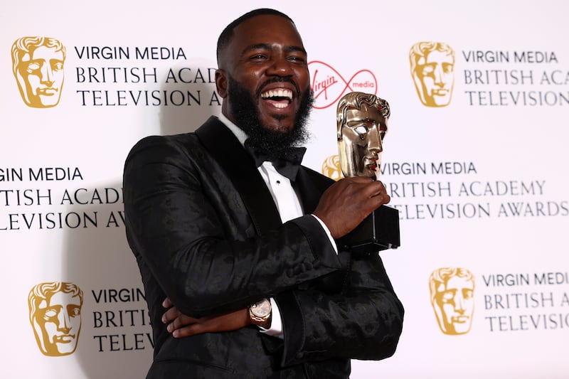 Mo Gilligan poses with the "Best Comedy/Entertainment Programme" award for "The Lateish Show with Mo Gilligan" at the British Academy Television Awards in London, Britain, May 8, 2022. REUTERS/Henry Nicholls