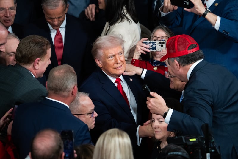 UNITED STATES - FEBRUARY 24: President Donald Trump greets members including Rep. Jimmy Patronis, R-Fla., in hat, before delivering his State of the Union address in the House Chamber of the U.S. Capitol on Tuesday, February 24, 2026. (Tom Williams/CQ-Roll Call, Inc via Getty Images)