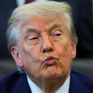 U.S. President Donald Trump reacts