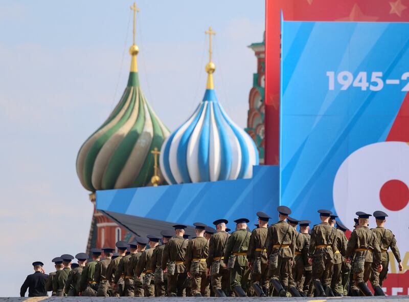Russian service members walks towards Red Square decorated for the Victory Day military parade, marking the anniversary of victory over Nazi Germany in World War Two, in central Moscow, Russia, May 5, 2026.
