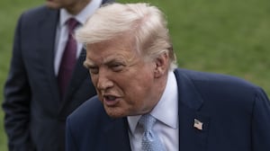 WASHINGTON DC, UNITED STATES - MARCH 20: United States President Donald Trump (R) speaks to the press before his departs the White House en route Miami, Florida on March 20, 2026, in Washington DC. Also The United States Secretary of State Marco Rubio (L) is seen. (Photo by Celal Gunes/Anadolu via Getty Images)