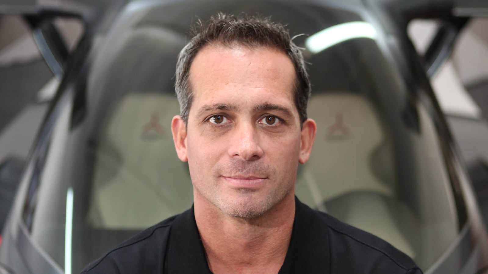 Founder and CEO Kirk Hawkins poses for photographs in front of a show model ICON A5 aircraft at ICON's offices and show room in Los Angeles, October 8, 2013. (Photo by Ann Johansson/Corbis via Getty Images)