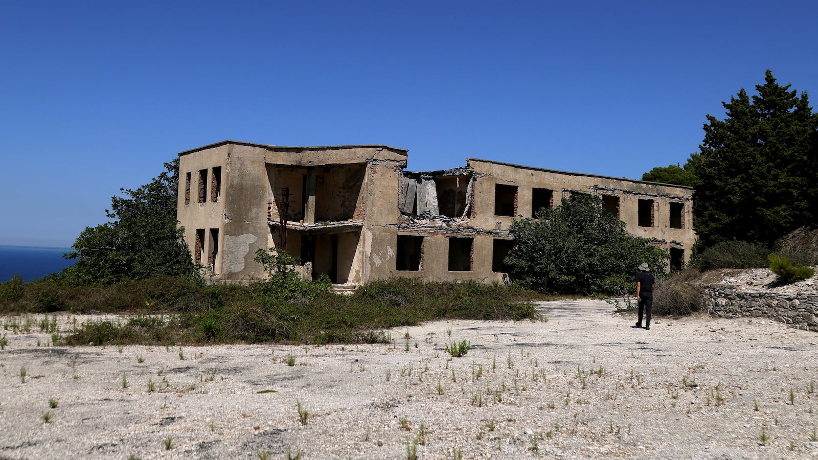 An abandoned ex-military command building on a hilltop on the island of Sazan, near the Albanian city of Vlore, on Mediterranean coast, on July 30 2024.