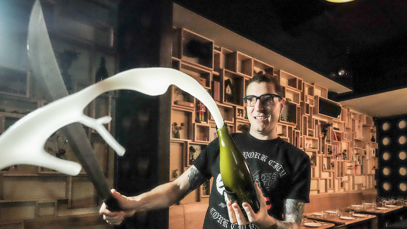 articles/2014/12/30/how-to-saber-a-champagne-bottle/141230-joiner-champagne-tease_zrhl4x