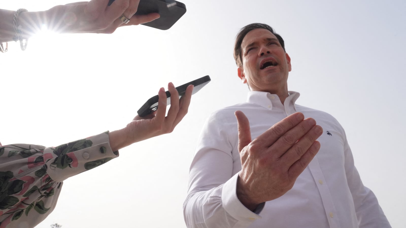 TOPSHOT - US Secretary of State Marco Rubio speaks to journalists before boarding his plane at Indira Gandhi International Airport in New Delhi on May 25, 2026. (Photo by Julia Demaree Nikhinson / POOL / AFP via Getty Images)