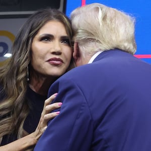 RAPID CITY, SOUTH DAKOTA - SEPTEMBER 08: Republican presidential candidate former President Donald Trump greets South Dakota Governor Kristi Noem after she introduced him at the Monument Leaders Rally hosted by the South Dakota Republican Party on September 08, 2023 in Rapid City, South Dakota. Noem endorsed Trump during the event.